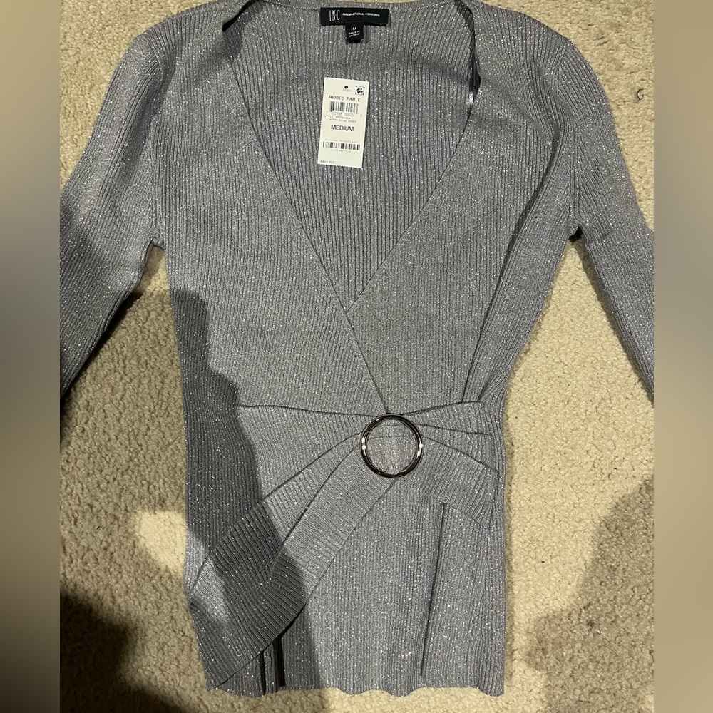 INC in silver that has some shimmer to it.  Size med new with tags.